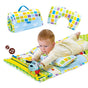 A baby lying on a colorful tummy time playmat with plush farm figures and a large pillow, with the mat shown rolled up and another section unfolded. - Thumbnail